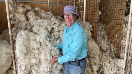 Bill Luff with a bin of 19-20 micron Merino fleeces at Cotway, Adjungbilly.