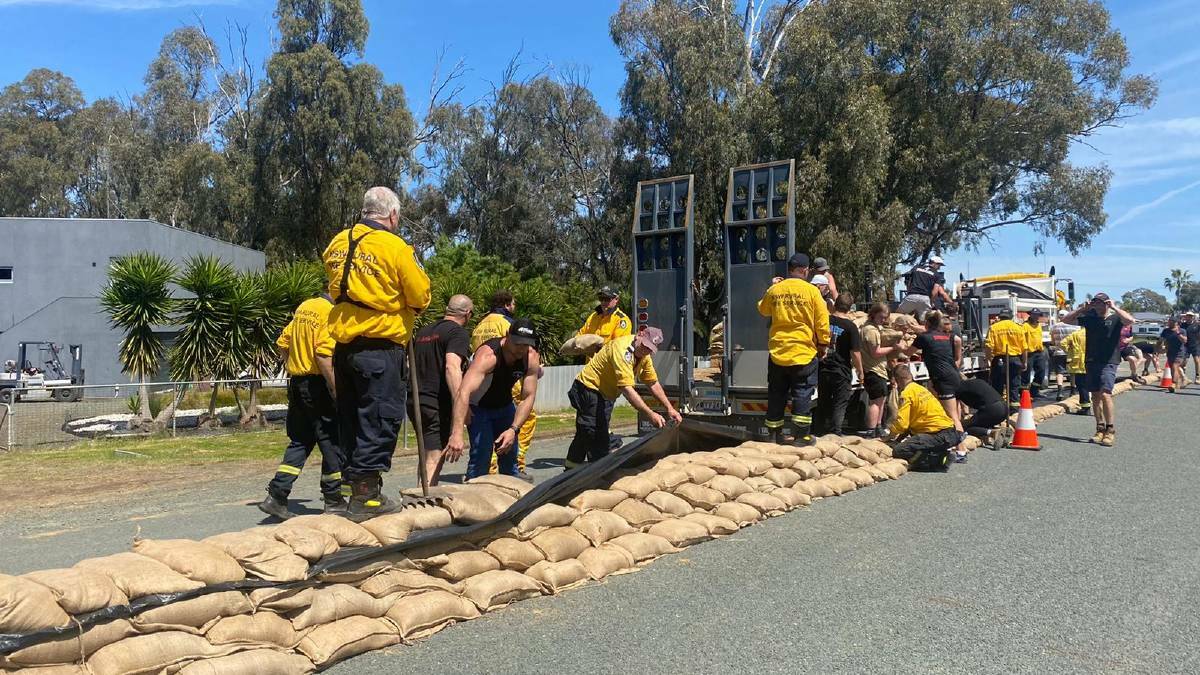 Sandbagging is carried out around critical infrastructure in Moama during the 2022 floods. File picture by NSW Rural Fire Service
