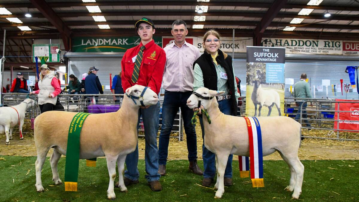 Archie Crowe, Farrer Memorial Agricultural High School, reserve champion ewe Farrer 23, judge Shane Baker, Booloola White Suffolk, Banringhup, Vic, Izzabelle Campbell, Macarthur Anglican School, and champion ewe Macarthur 230032. Picture by Elka Devney