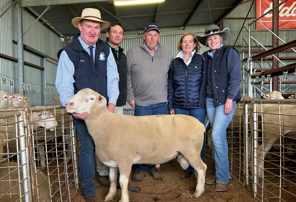 One of the four equal top-priced rams, Barwon 220971, purchased by Neale and Katrina Morris, Rickaveera Farming, Ardlethan, with Mark Yates, Barwon Poll Dorsets and White Suffolks, Yerong Creek, Hamish McGeoch, Nutrien Wagga Wagga, Neale, Katrina and Emma Morris, Rickaveera Farming, Ardlethan. Photo supplied. 