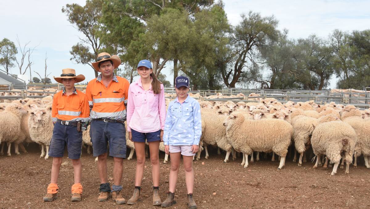James, 14, Hugh, Sophie, 15 and Claire, 11, Cruikshank, Burgess Hill, Ganmain, with a portion of the families first cross ewes, which are due to lamb in March. Photo by Helen De Costa. 