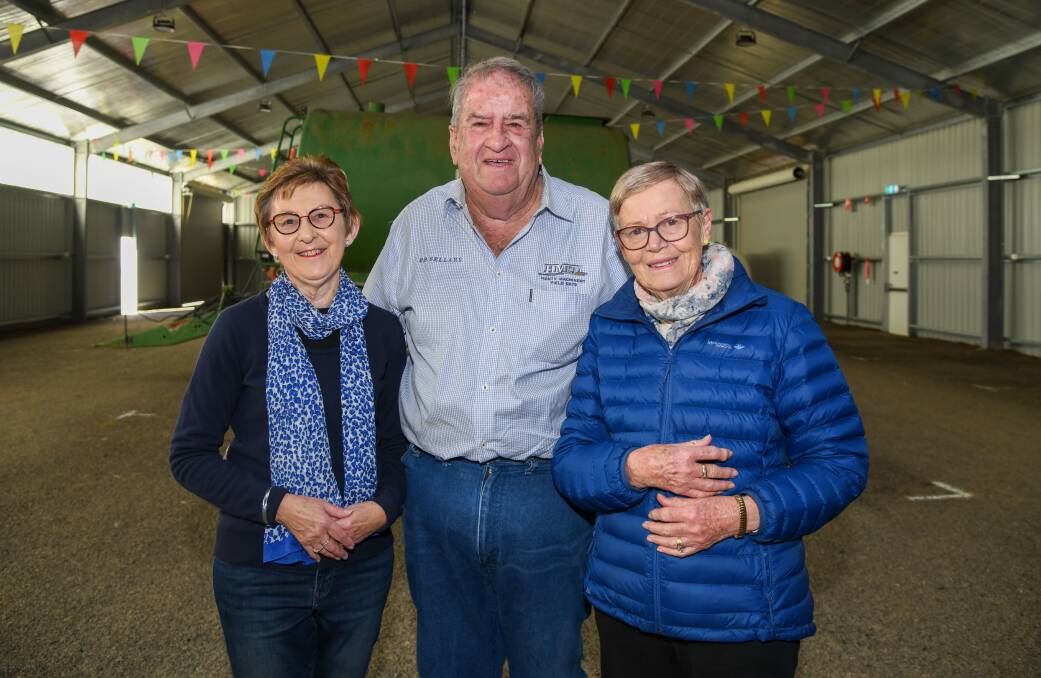 Medal of the Order of Australia (OAM) recipient Ross Edwards celebrates his honour with Henty Machinery Filed Days secretary Heather Barrett (left) and his wife Heather (right) at the Taylor Wood Pavilion. Picture by Bernard Humphreys